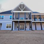 exterior of new Trade Mark home with 2-story porch